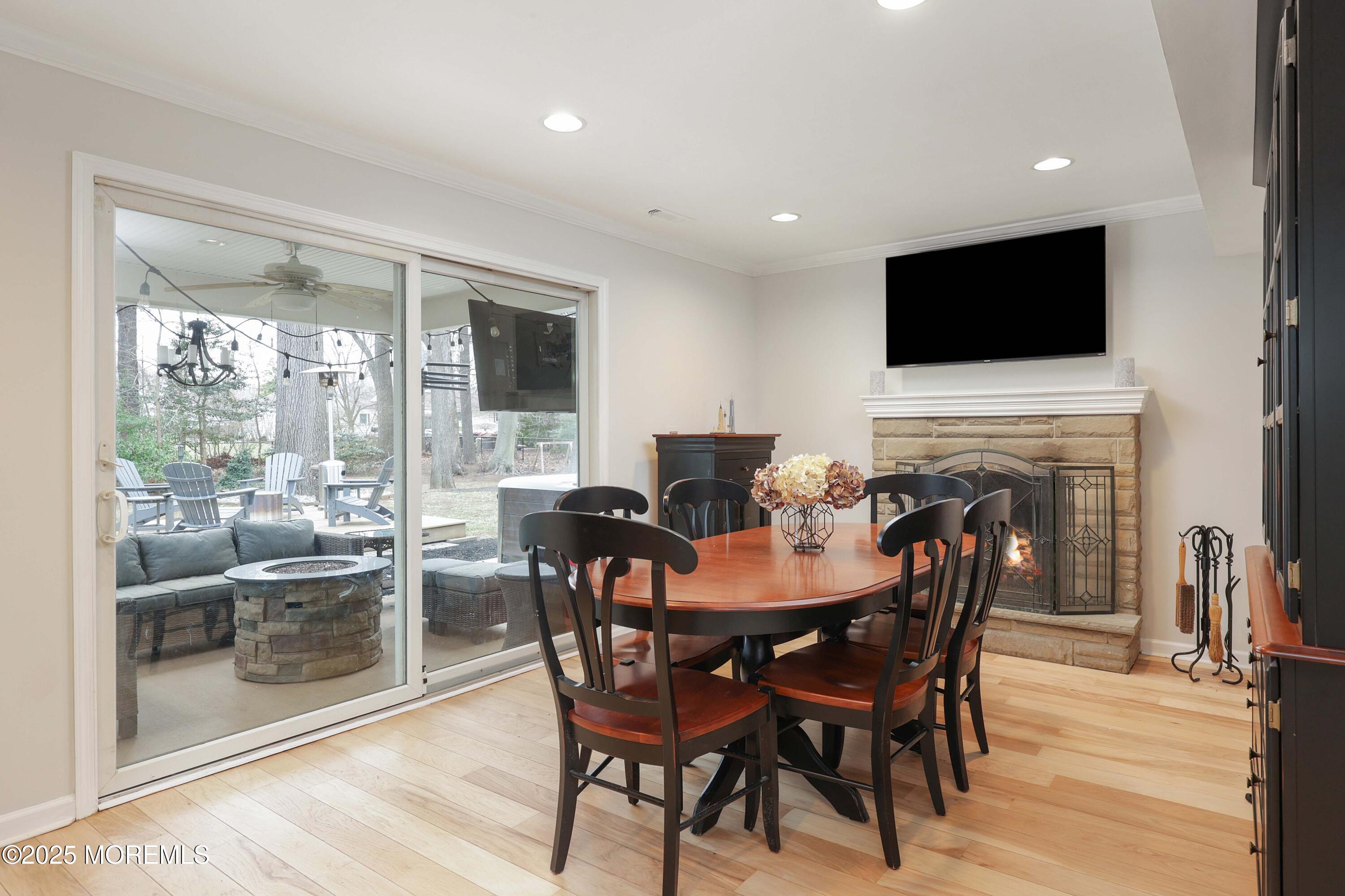 125 Jumping Brook Road Lincroft, NJ 07738 - Photo 25 of 47 a view of a dining room with furniture window and wooden floor
