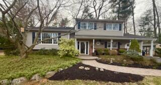125 Jumping Brook Road Lincroft, NJ 07738 - Photo 3 of 47 front view of a house with a yard