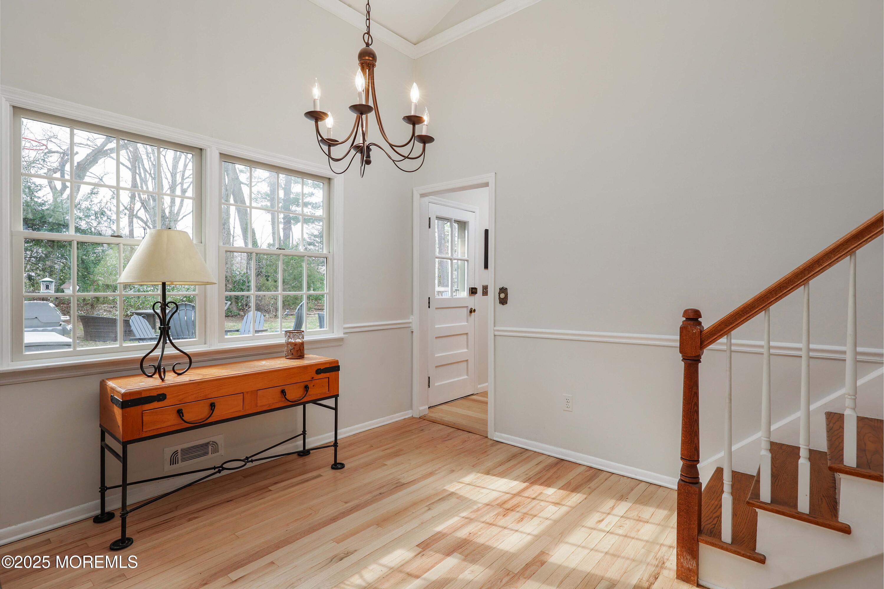 125 Jumping Brook Road Lincroft, NJ 07738 - Photo 34 of 47 a room with stairs and wooden floor
