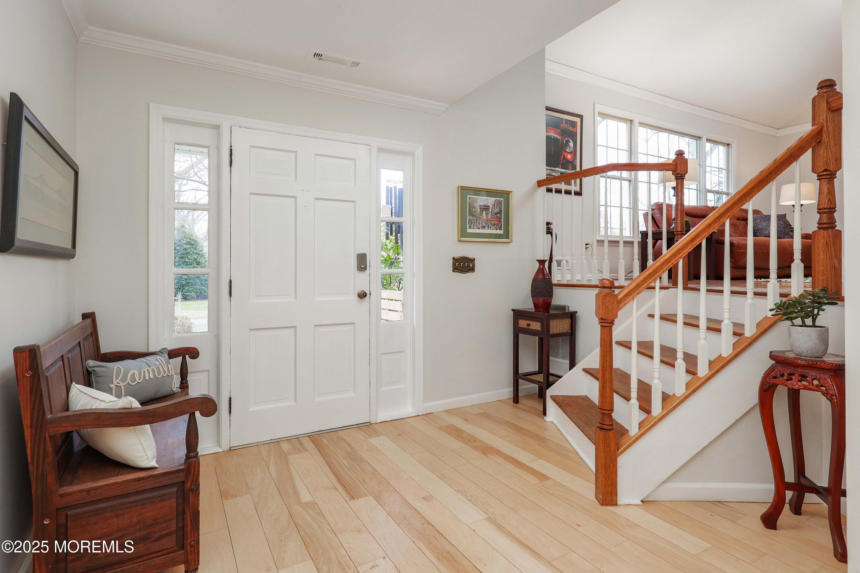 125 Jumping Brook Road Lincroft, NJ 07738 - Photo 36 of 47 a view of entryway livingroom and hall with wooden floor