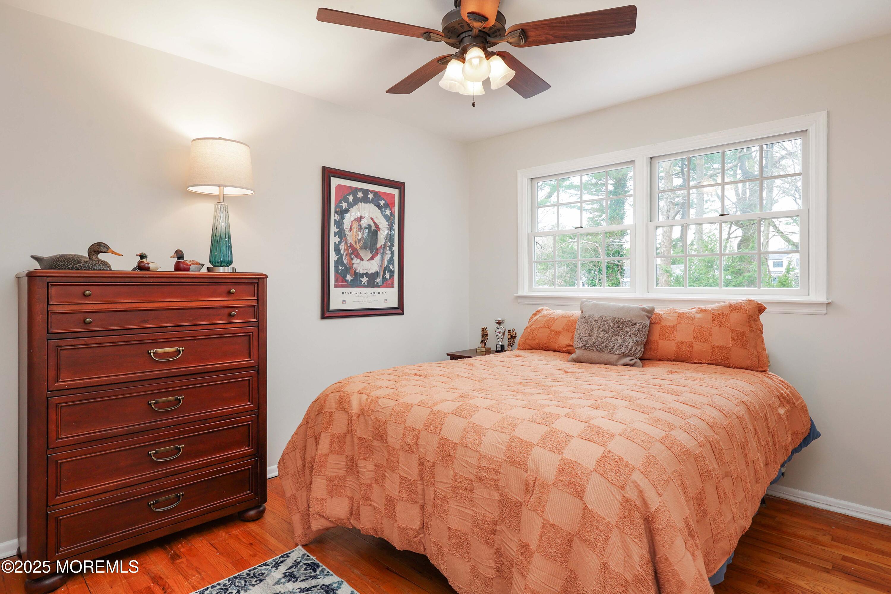 125 Jumping Brook Road Lincroft, NJ 07738 - Photo 40 of 47 a bedroom with a bed and a window