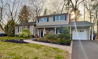 125 Jumping Brook Road Lincroft, NJ 07738 - Photo 4 of 47 front view of a house with a yard
