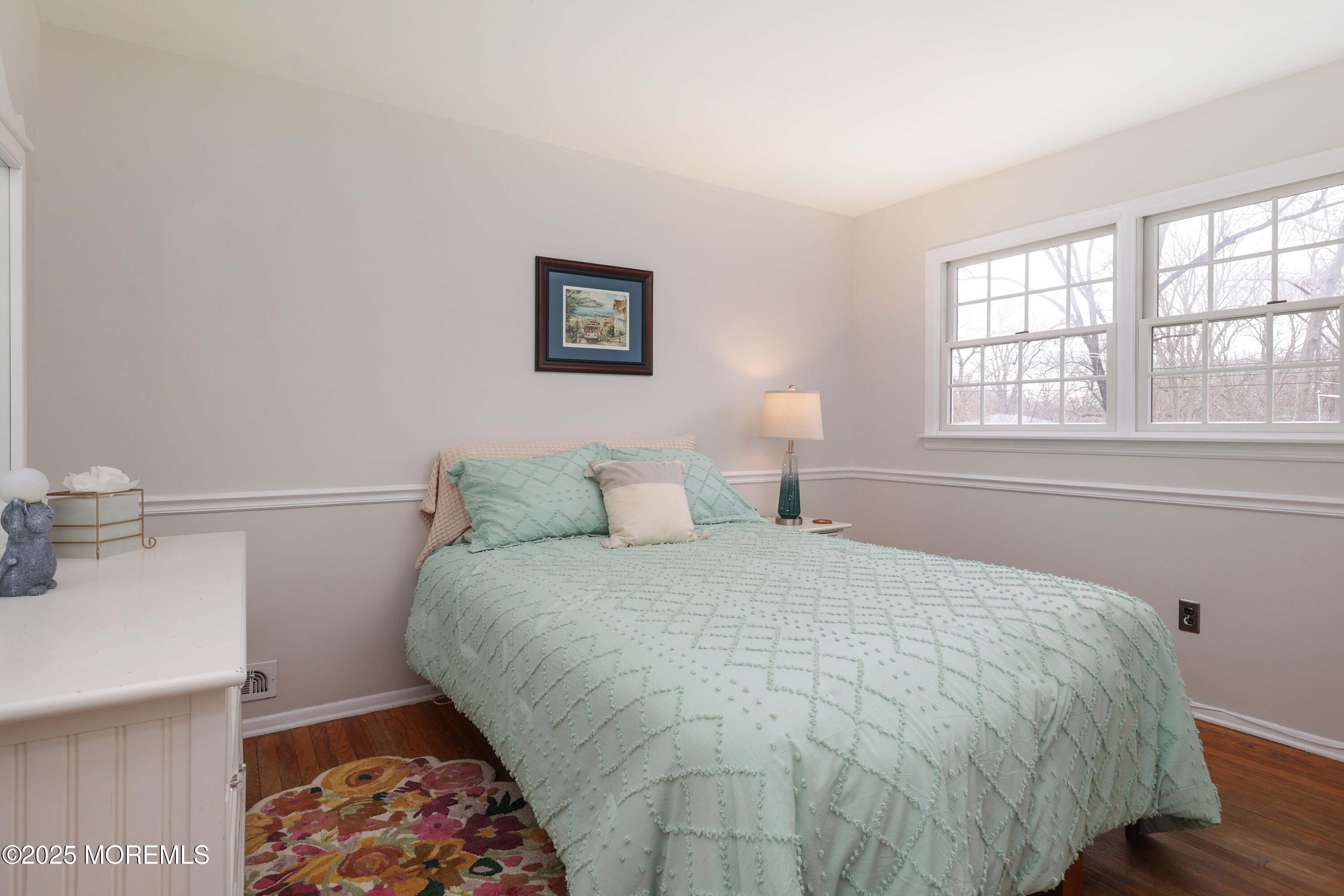 125 Jumping Brook Road Lincroft, NJ 07738 - Photo 42 of 47 a large bed sitting in a bedroom next to a window