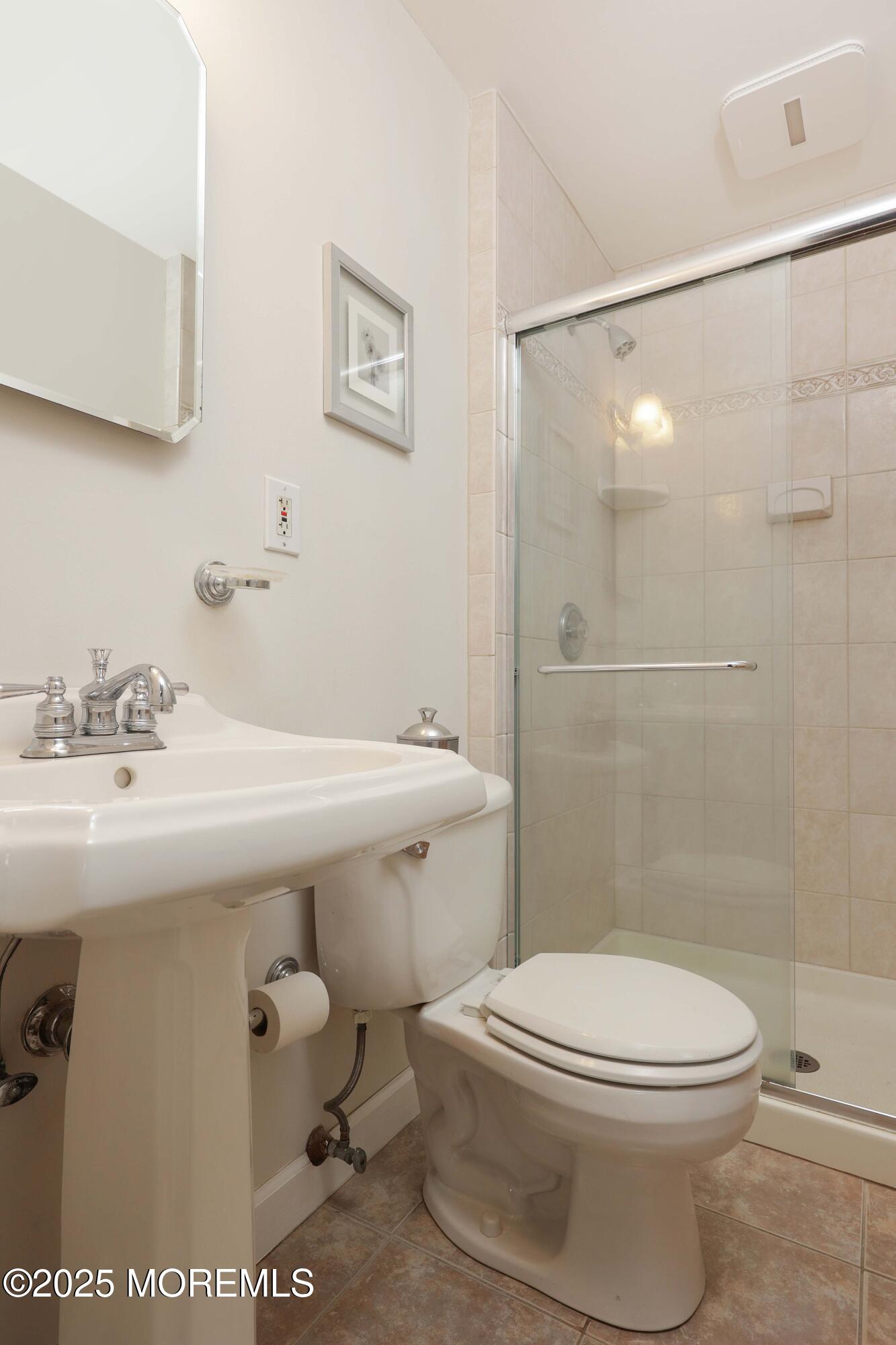 125 Jumping Brook Road Lincroft, NJ 07738 - Photo 45 of 47 a bathroom with a sink toilet and shower
