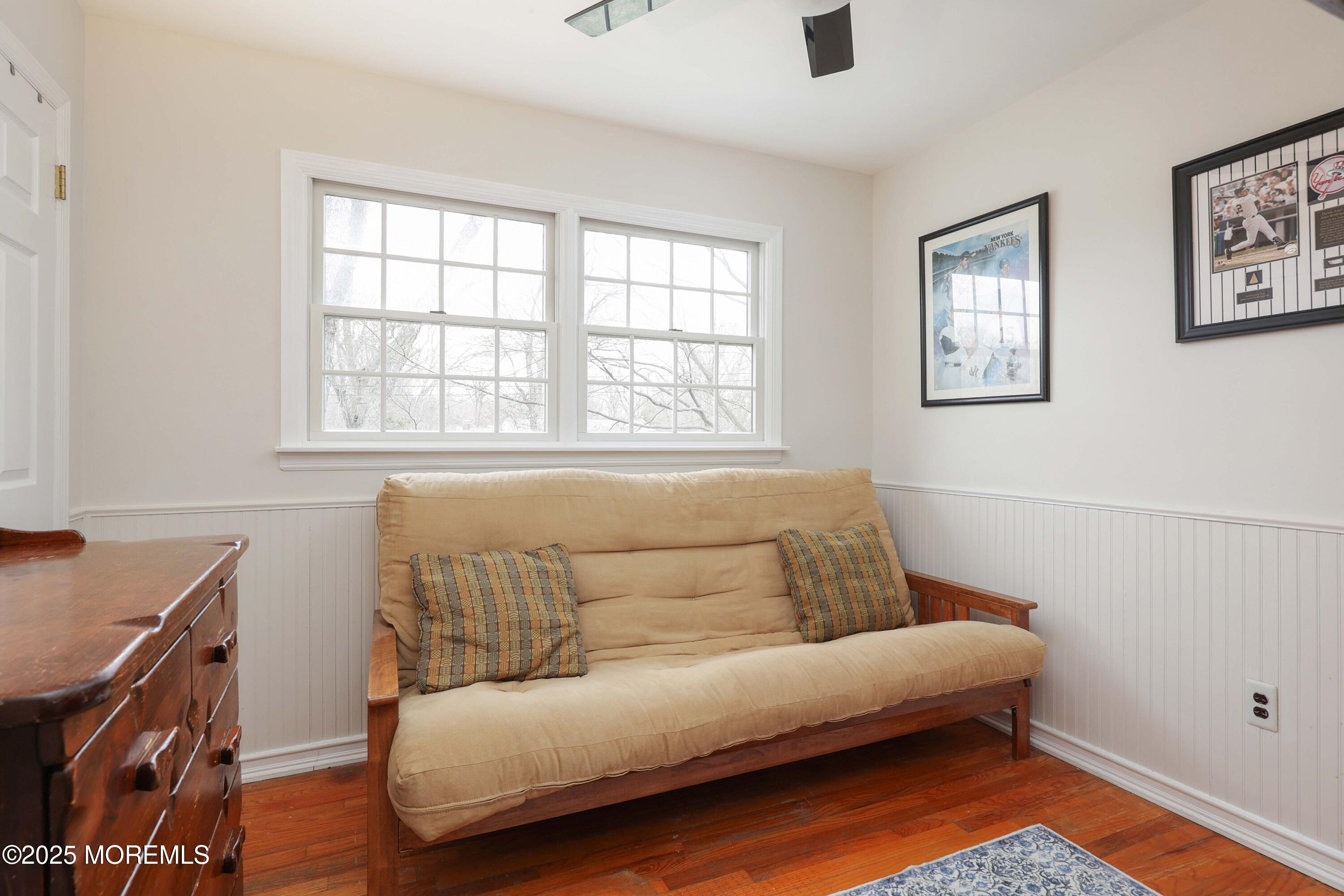 125 Jumping Brook Road Lincroft, NJ 07738 - Photo 46 of 47 a living room with furniture and a window