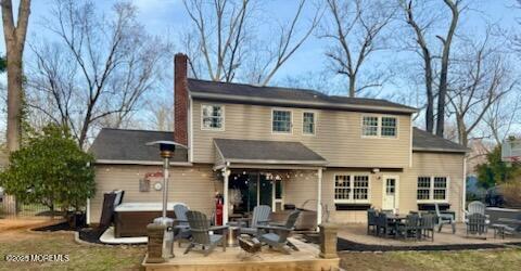 125 Jumping Brook Road Lincroft, NJ 07738 - Photo 5 of 47 a view of a house with a patio