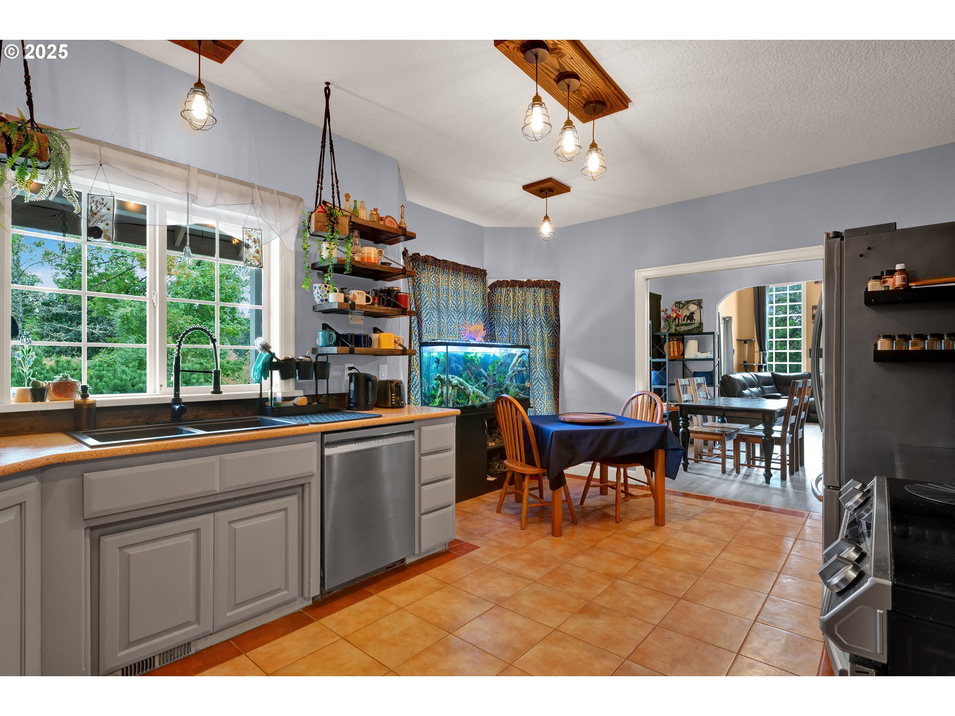 33530 Molitor Ranch Road Cottage Grove, OR 97424 - Photo 13 of 40 a kitchen with kitchen island granite countertop a table and chairs