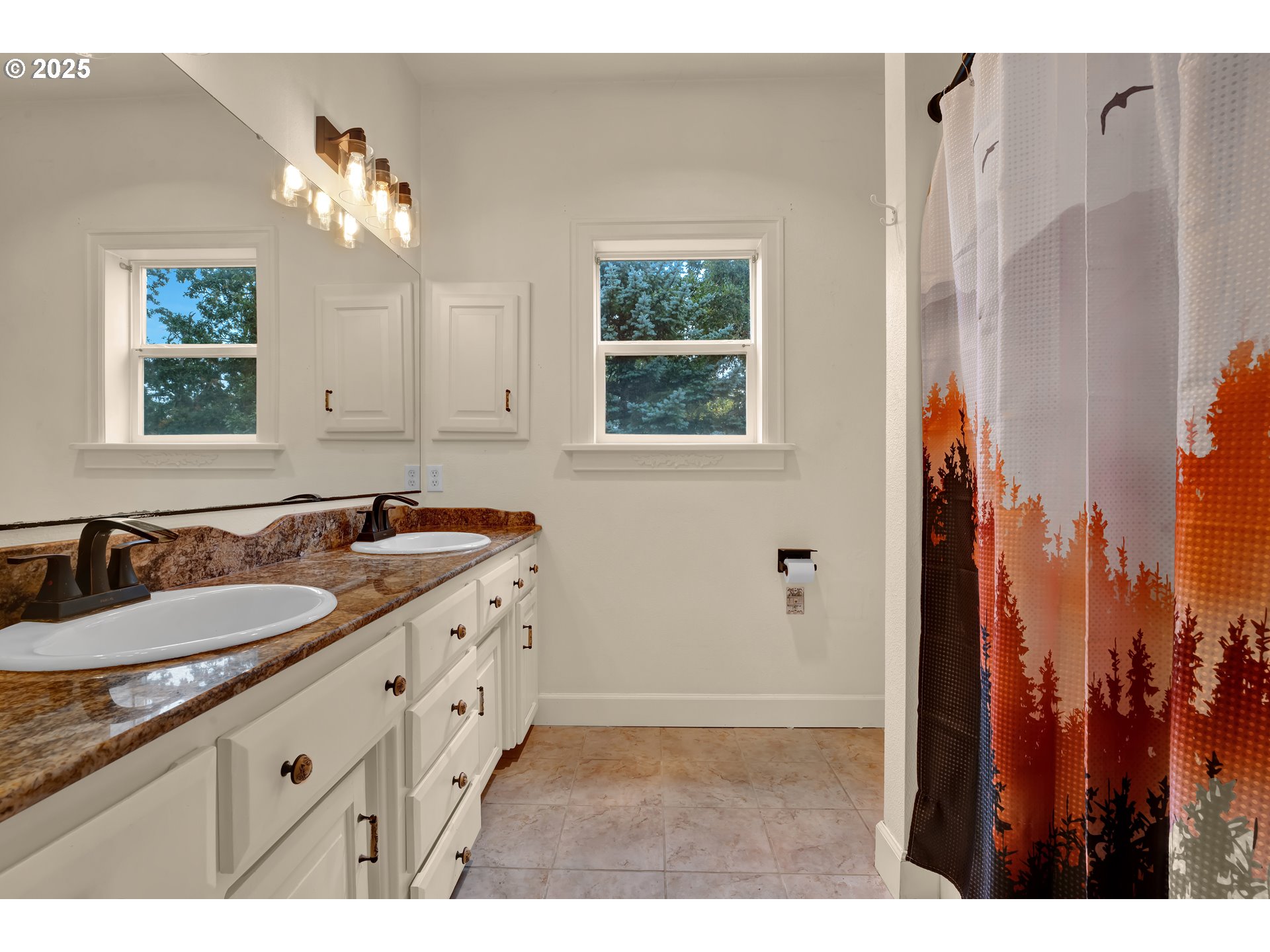 33530 Molitor Ranch Road Cottage Grove, OR 97424 - Photo 16 of 40 a bathroom with a granite countertop sink a large mirror and a shower