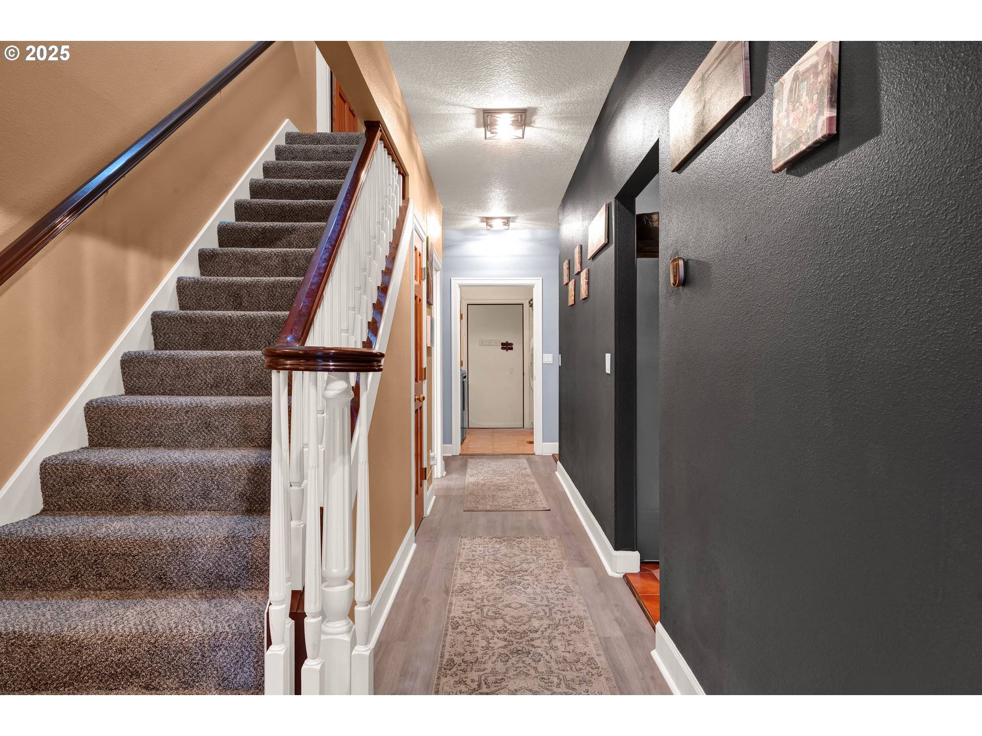 33530 Molitor Ranch Road Cottage Grove, OR 97424 - Photo 20 of 40 a view of staircase with lots of frames on wall