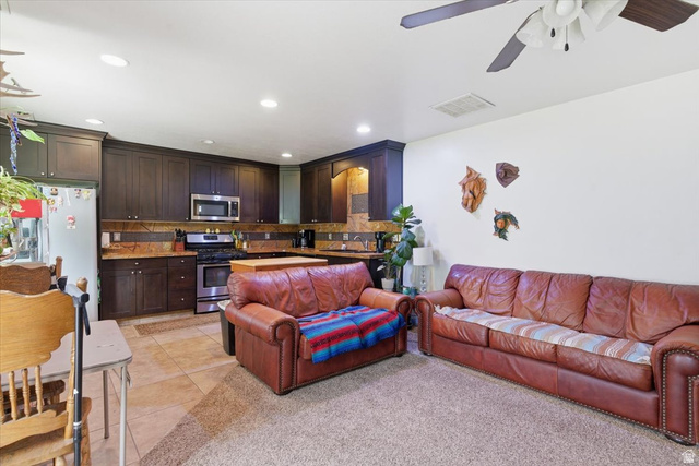 6237 West 4600th Street South Hooper, UT 84315 - Photo 25 of 48 Living area with a ceiling fan, light tile patterned floors, and recessed lighting