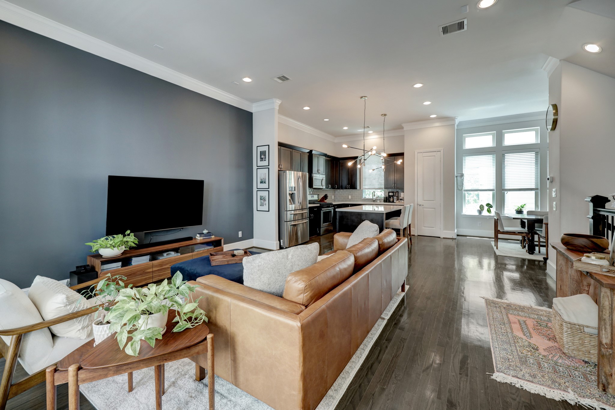 2231 Chenevert Street Houston, TX 77003 - Photo 15 of 26 a living room with fireplace furniture and a flat screen tv