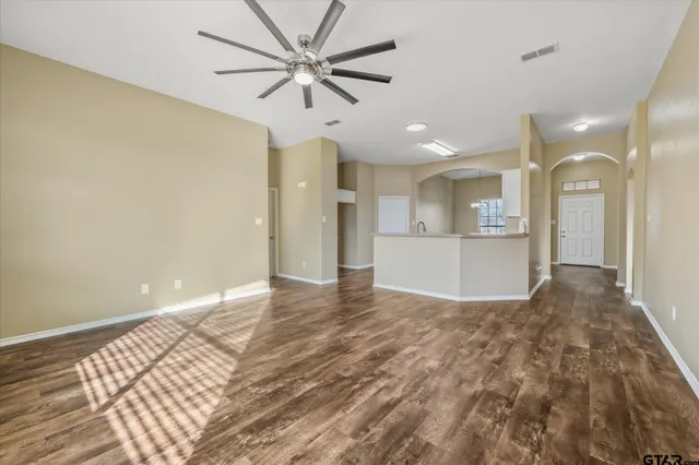 a view of a kitchen with a sink and a refrigerator