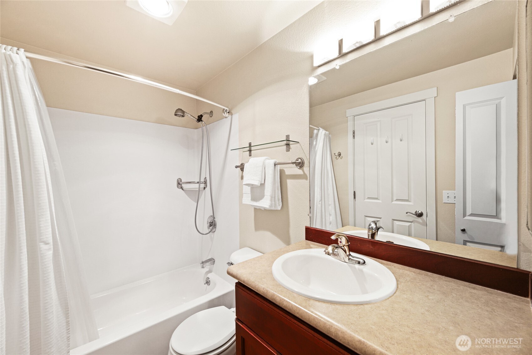 566 Prospect Street, Unit 209 Seattle, WA 98109 - Photo 11 of 16 a bathroom with a sink a toilet and shower