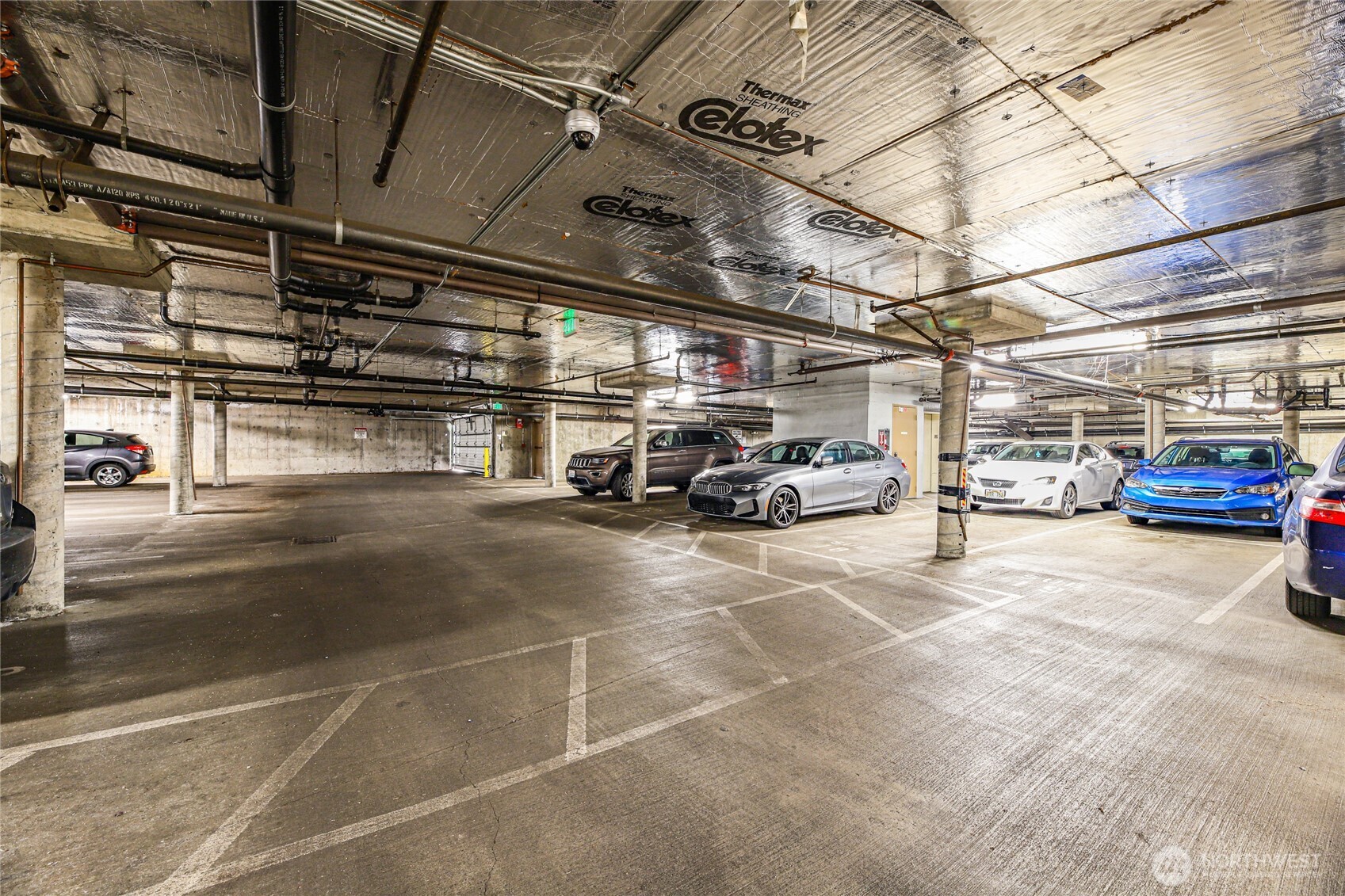 566 Prospect Street, Unit 209 Seattle, WA 98109 - Photo 13 of 16 a view of parking garage with cars