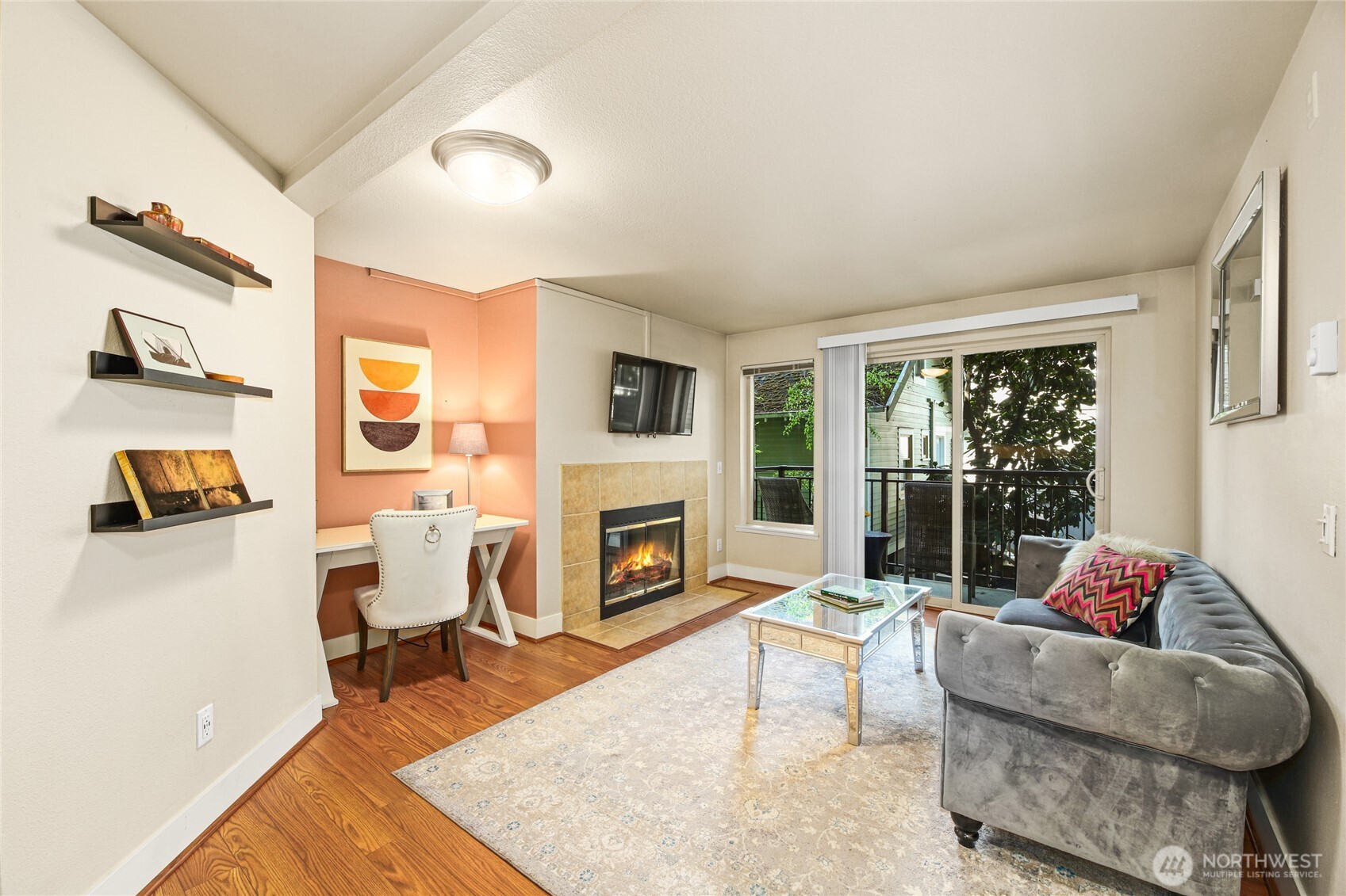 566 Prospect Street, Unit 209 Seattle, WA 98109 - Photo 7 of 16 a living room with furniture and a fireplace