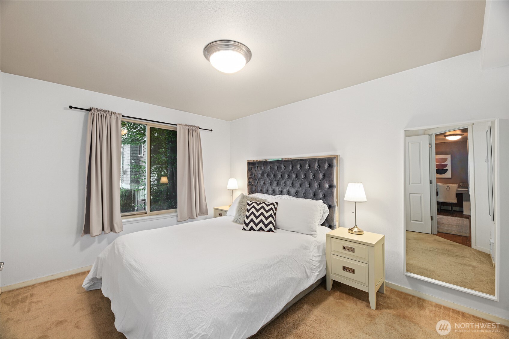 566 Prospect Street, Unit 209 Seattle, WA 98109 - Photo 10 of 16 a bedroom with a large bed and a large window