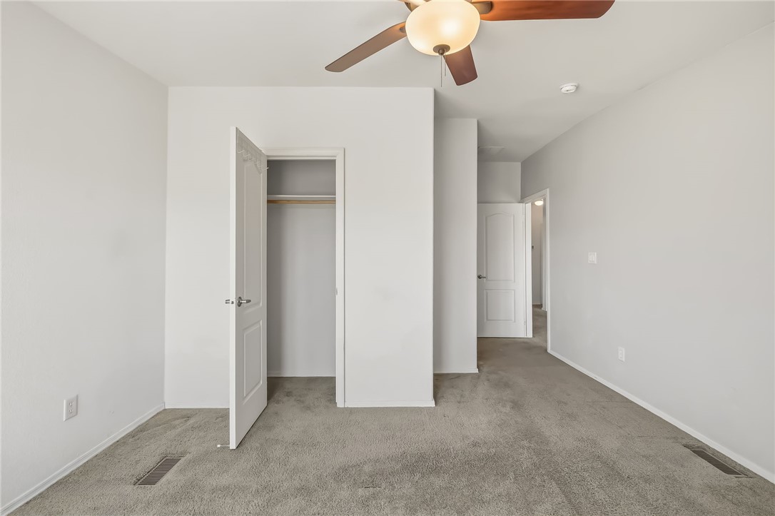 2525 South Ridge Avenue Bullhead City, AZ 86429 - Photo 51 of 76 Room featuring neutral carpeting, light gray wall paint, and white trim