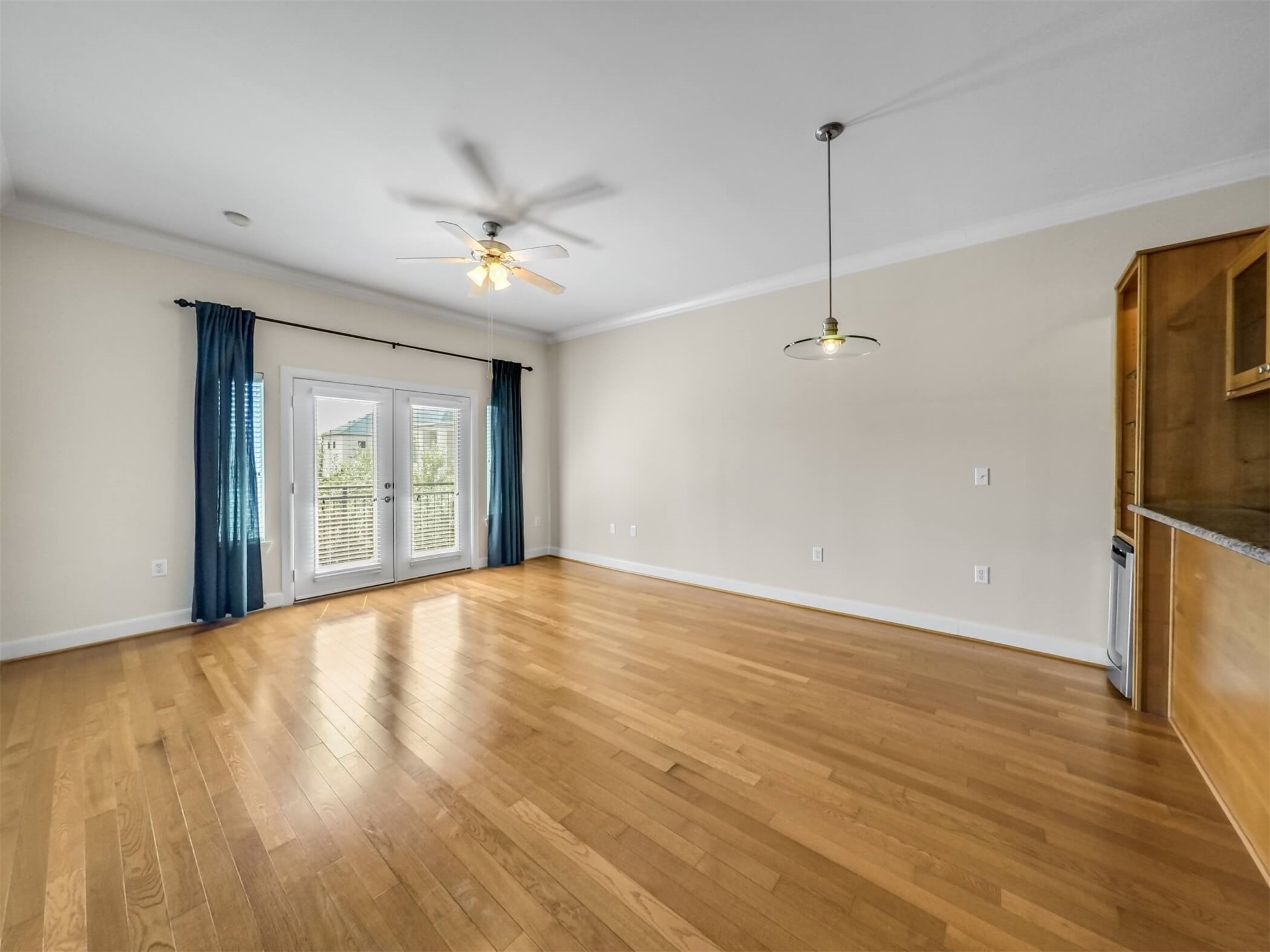 1010 Rosine Street, Unit 22 Houston, TX 77019 - Photo 12 of 21 a view of an empty room with a window and wooden floor