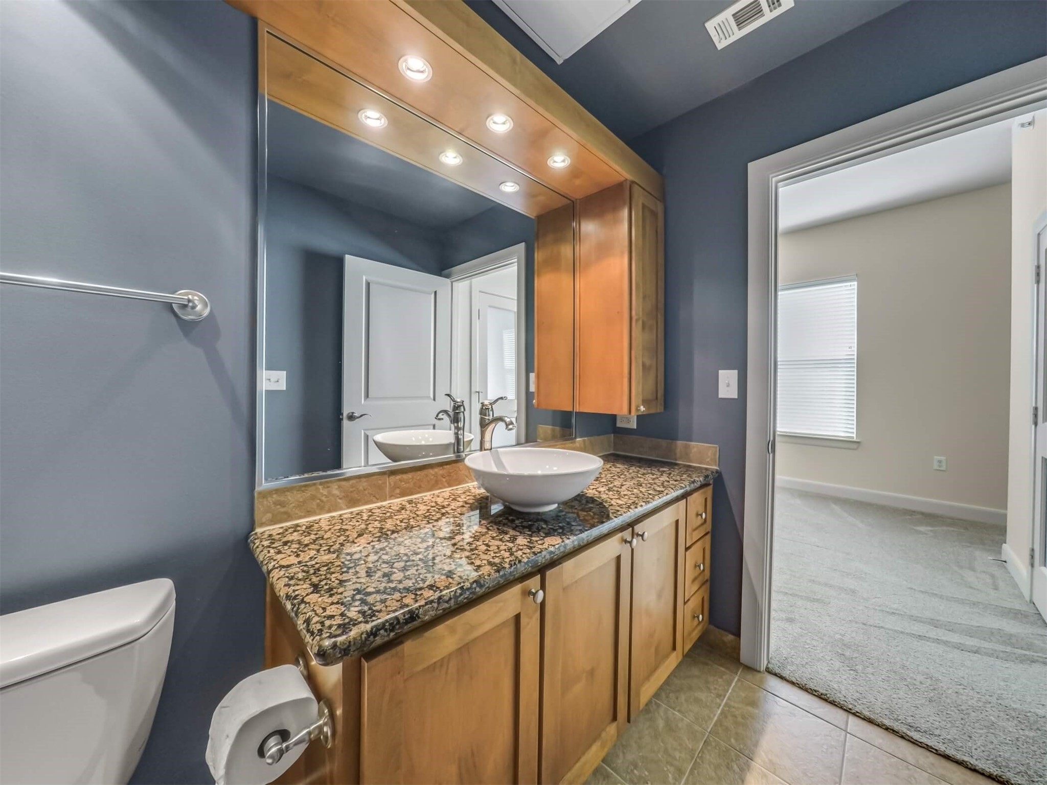 1010 Rosine Street, Unit 22 Houston, TX 77019 - Photo 14 of 21 a bathroom with a granite countertop sink and a mirror