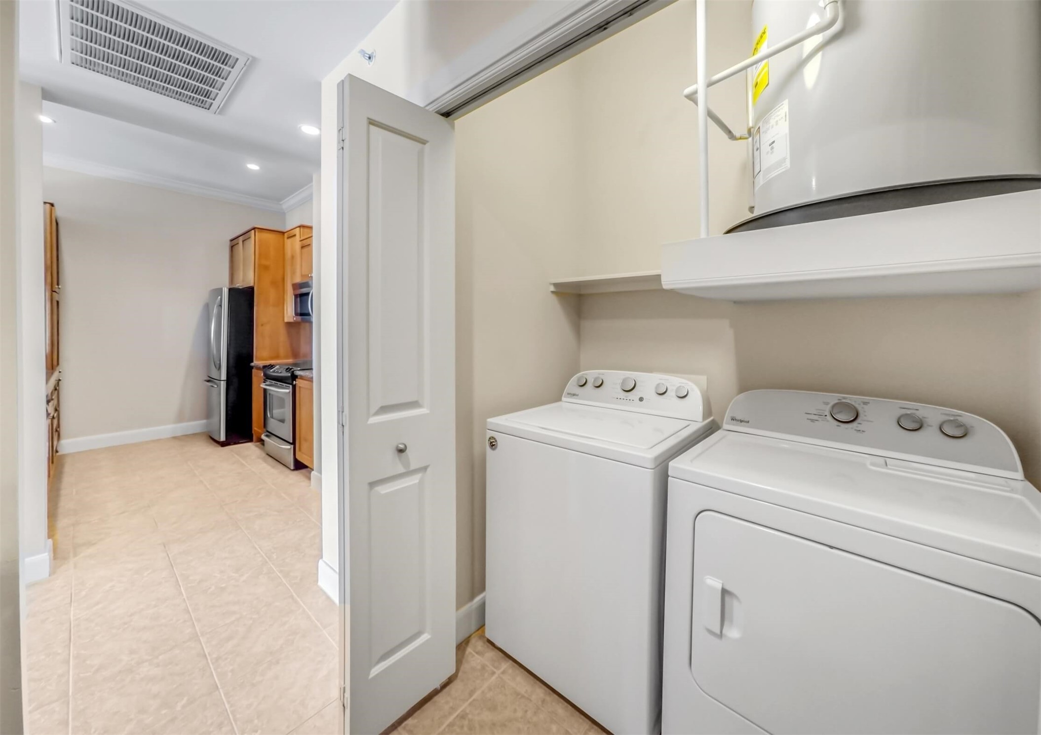 1010 Rosine Street, Unit 22 Houston, TX 77019 - Photo 10 of 21 a view of storage and utility room with washer and dryer