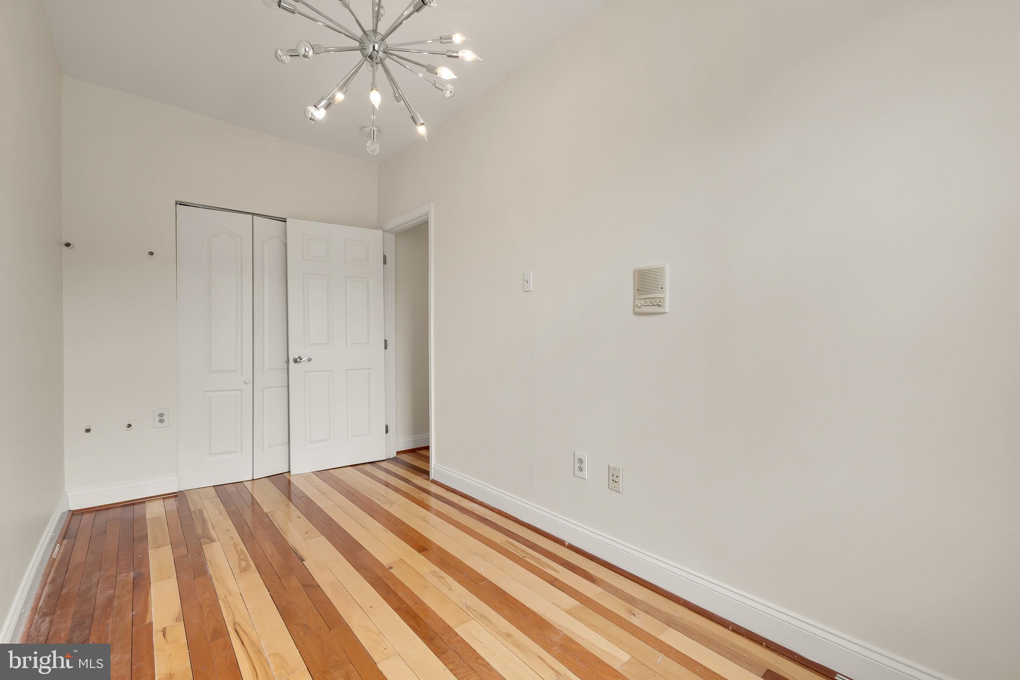730 15th Street Southeast, Unit 2 Washington, DC 20003 - Photo 12 of 16 a view of a room with wooden floor and fan