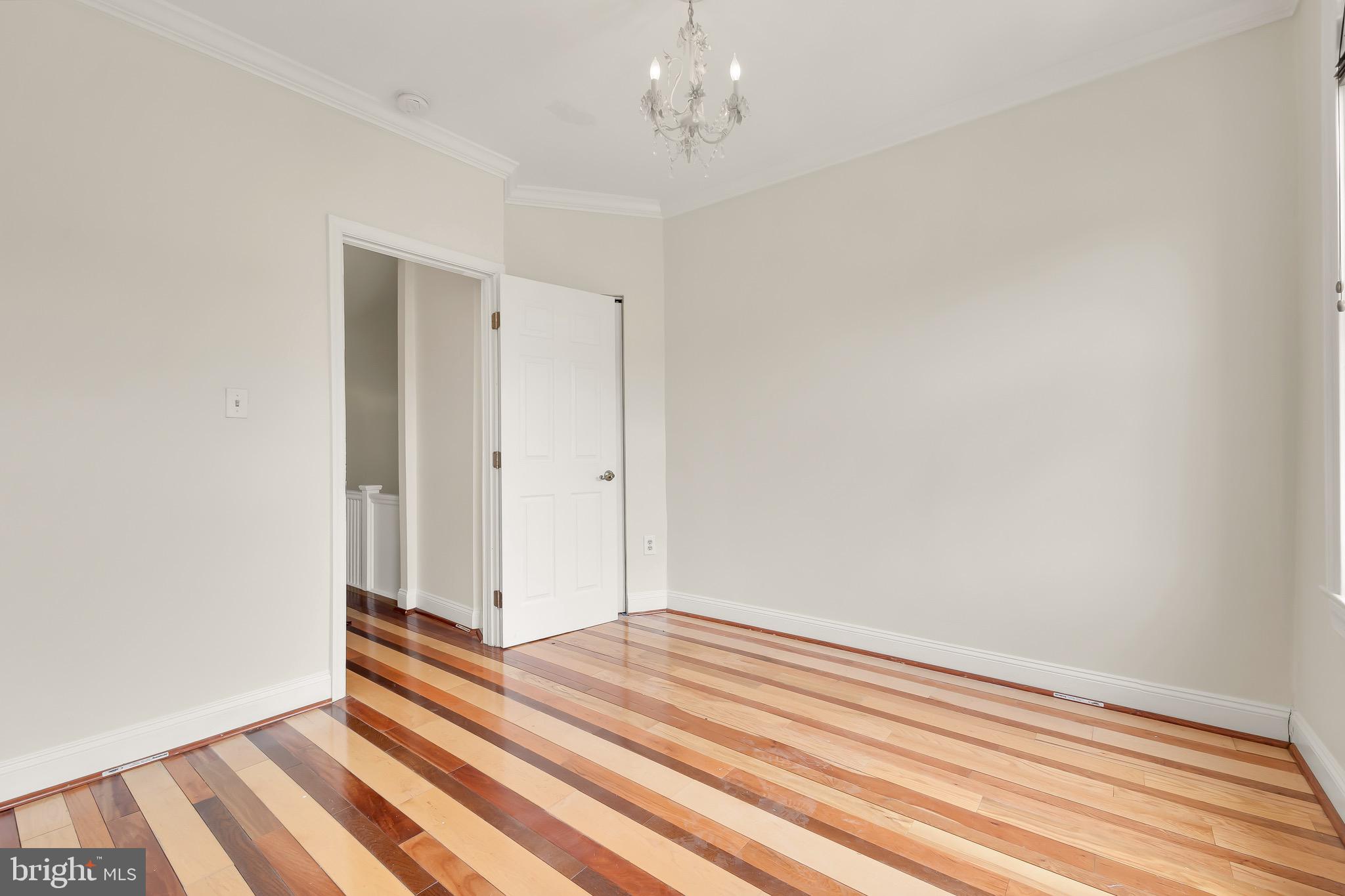 730 15th Street Southeast, Unit 2 Washington, DC 20003 - Photo 10 of 16 a view of a room with wooden floor and white walls