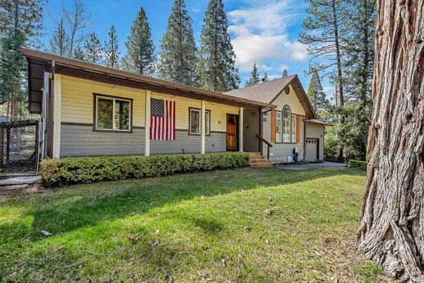 front view of a house with a yard