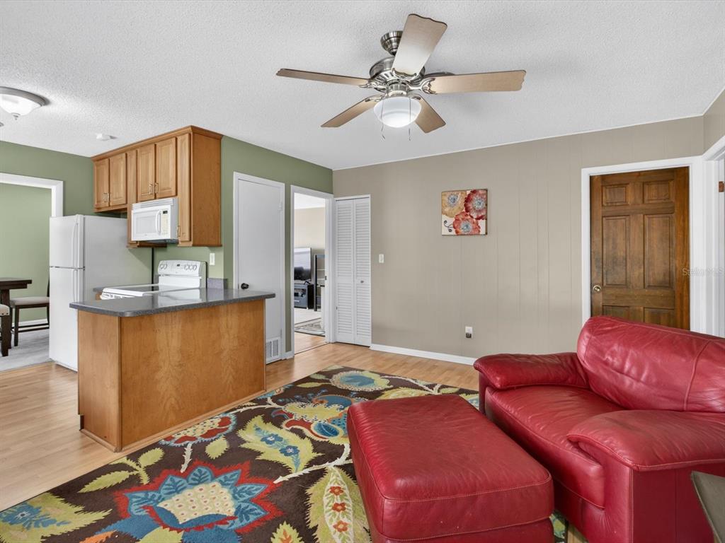2803 Banchory Road Winter Park, FL 32792 - Photo 10 of 31 a bedroom with a bed and a chandelier
