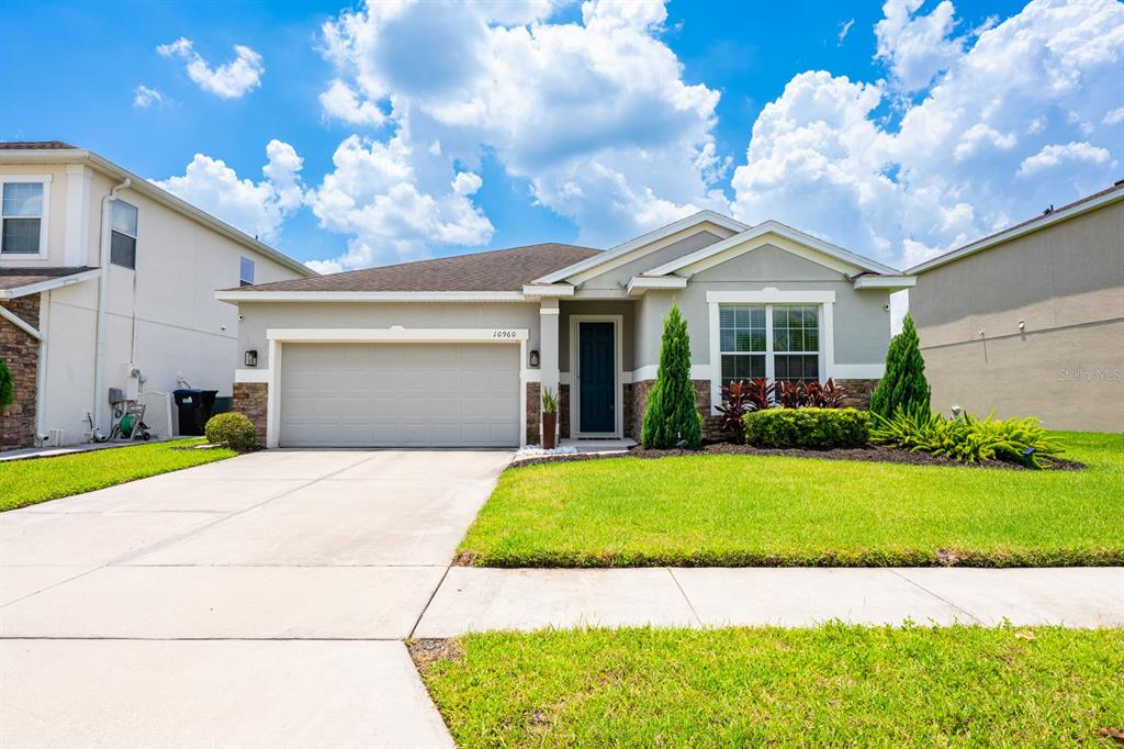 a view of a house with a big yard and plants