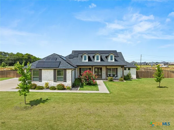 a view of a house with a big yard