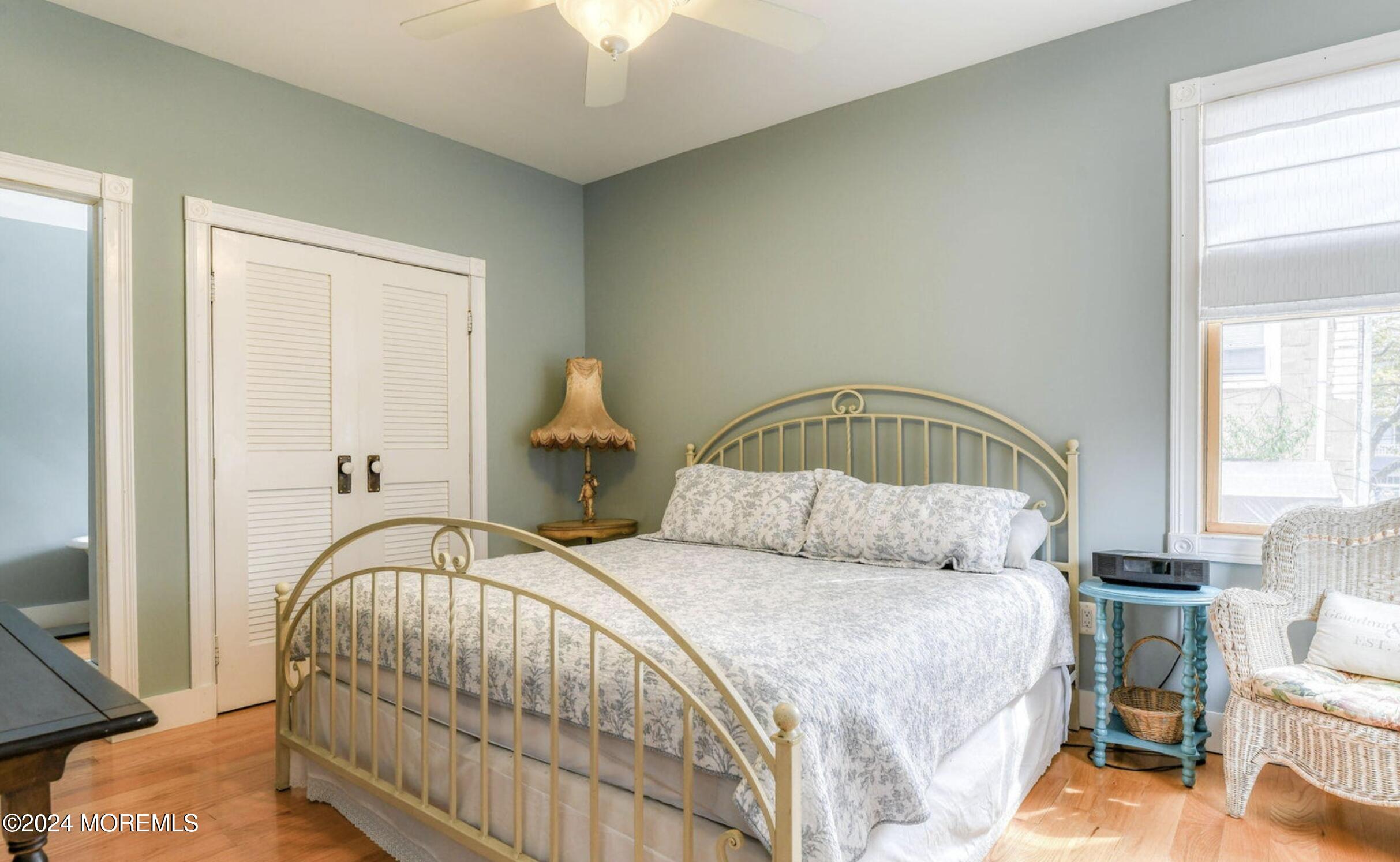 54 Olin Street Ocean Grove, NJ 07756 - Photo 4 of 21 a bedroom with a bed and a mirror