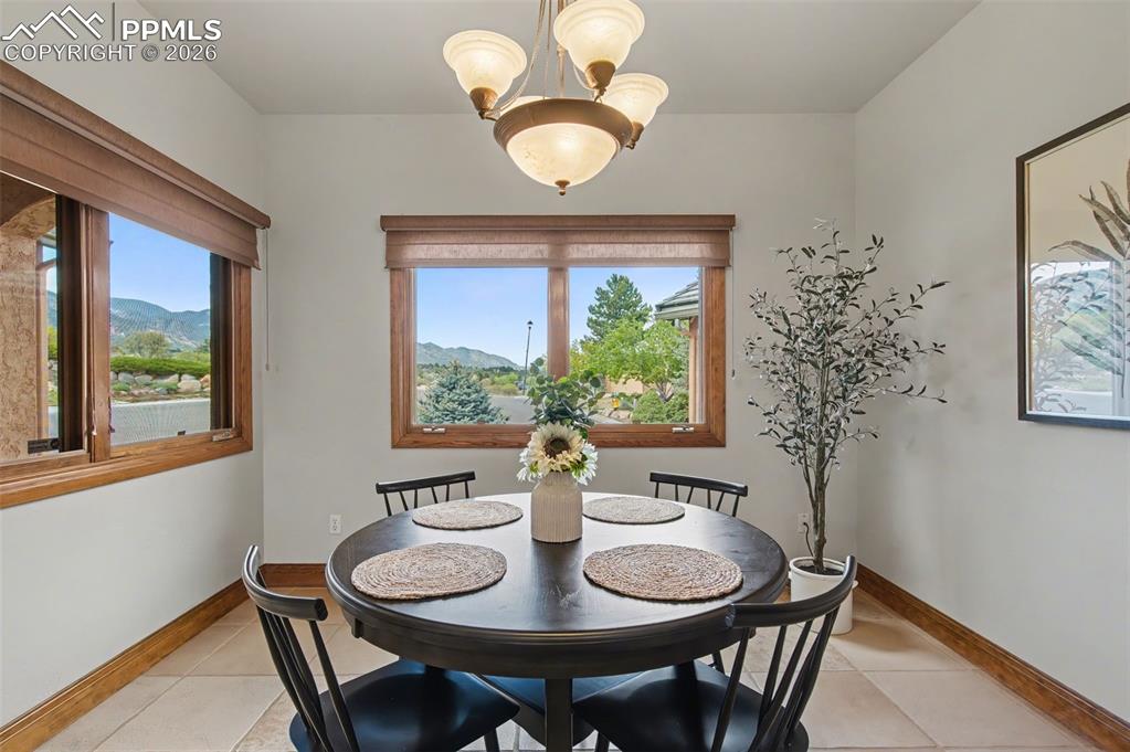 4215 Star Ranch Road Colorado Springs, CO 80906 - Photo 22 of 44 a view of a dining room with furniture window and outside view