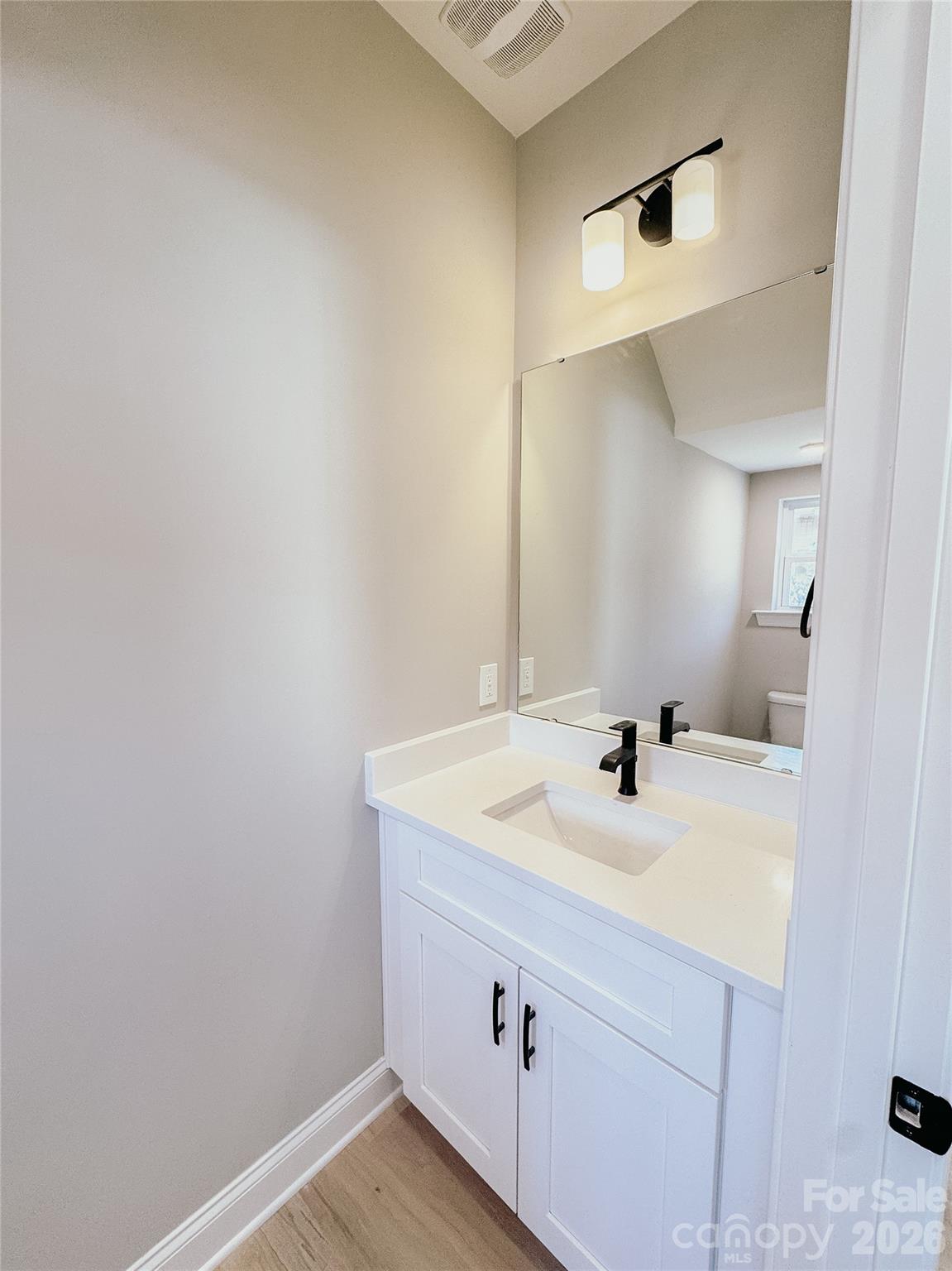 1455 West Ridge Road Salisbury, NC 28147 - Photo 12 of 26 a bathroom with a sink and a mirror