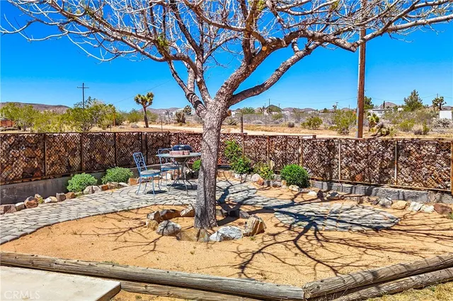 a kitchen with stainless steel appliances granite countertop a sink and a stove
