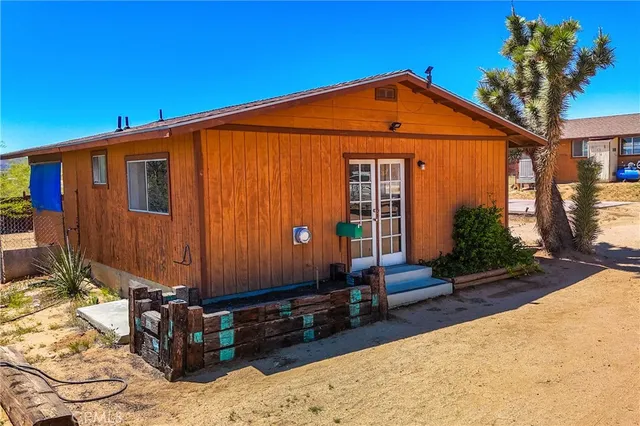 a view of a backyard of the house