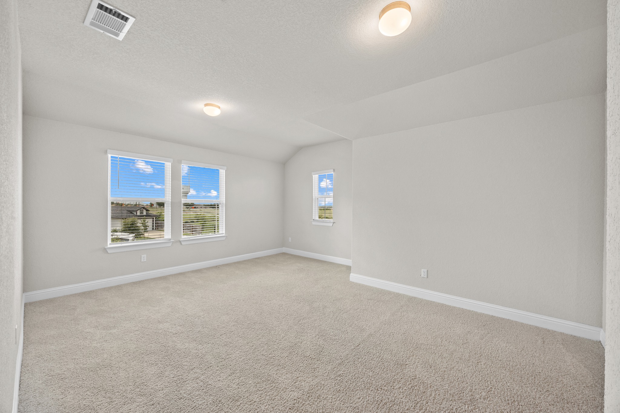 213 Graver Street Georgetown, TX 78626 - Photo 21 of 33 A generously sized room provides ample space for relaxation and versatile living arrangements.