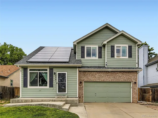 a front view of a house with a garage