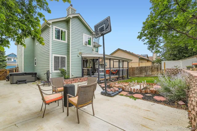 a front view of house with yard outdoor seating and barbeque oven