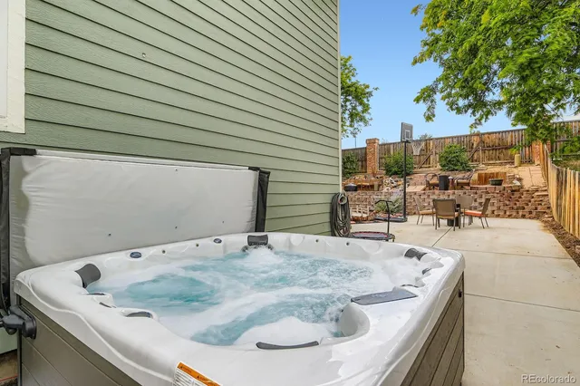swimming pool view with a seating space