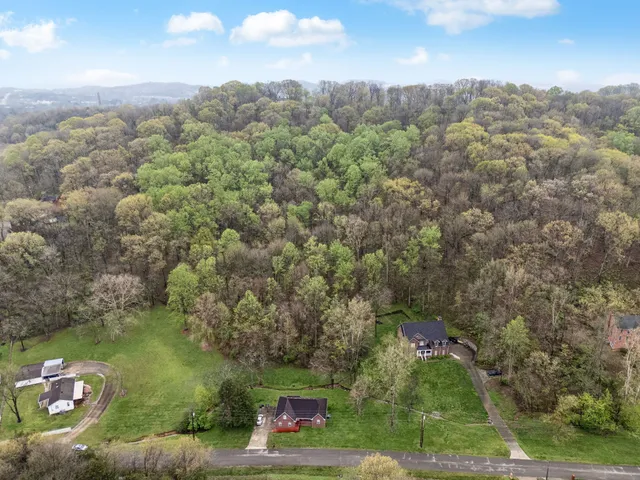 an aerial view of a houses with outdoor space
