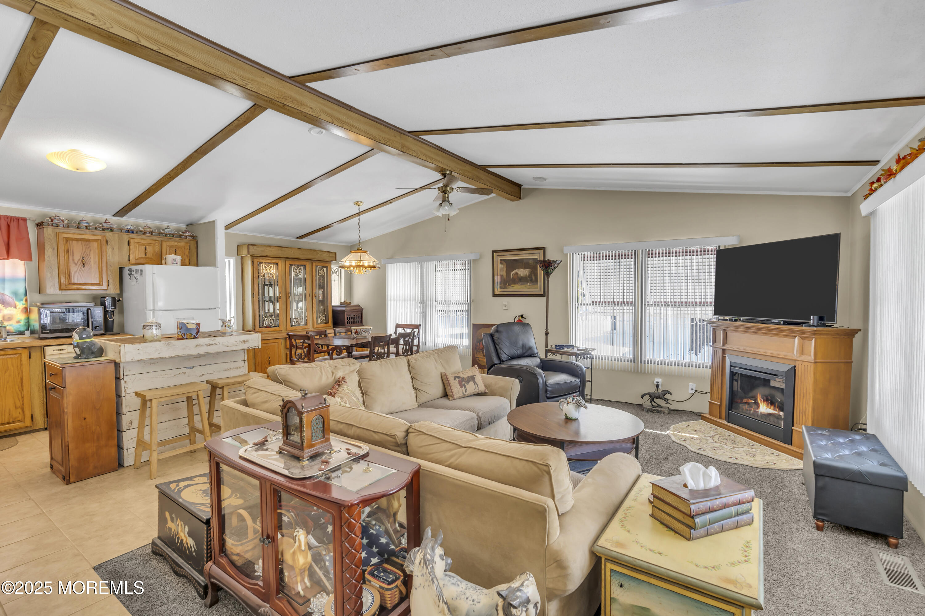 9 Greenway Trail Cream Ridge, NJ 08514 - Photo 2 of 19 a living room with fireplace furniture and a flat screen tv