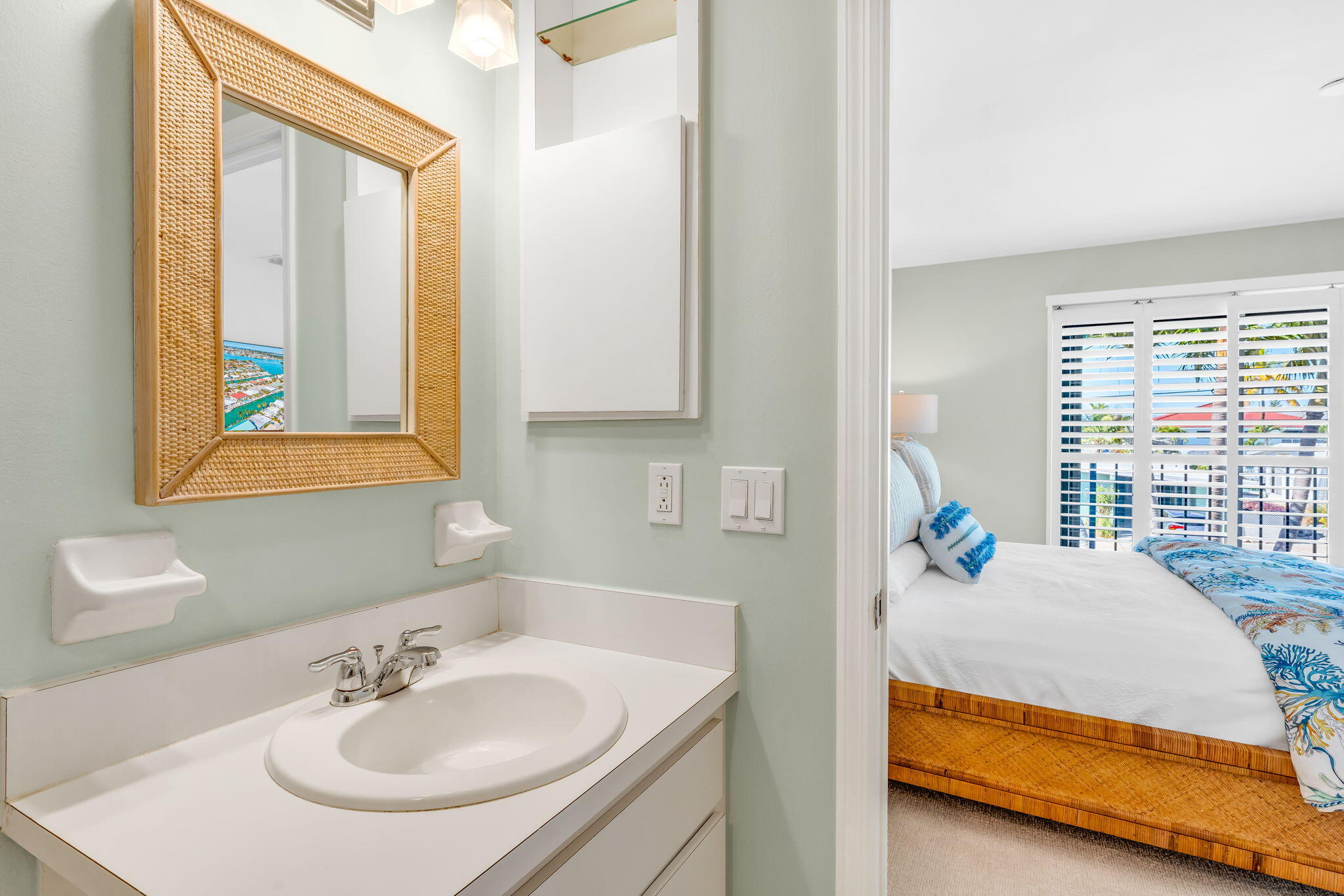 590 9th Street Key Colony Beach, FL 33051 - Photo 11 of 35 a en suite bathroom with sink and mirror