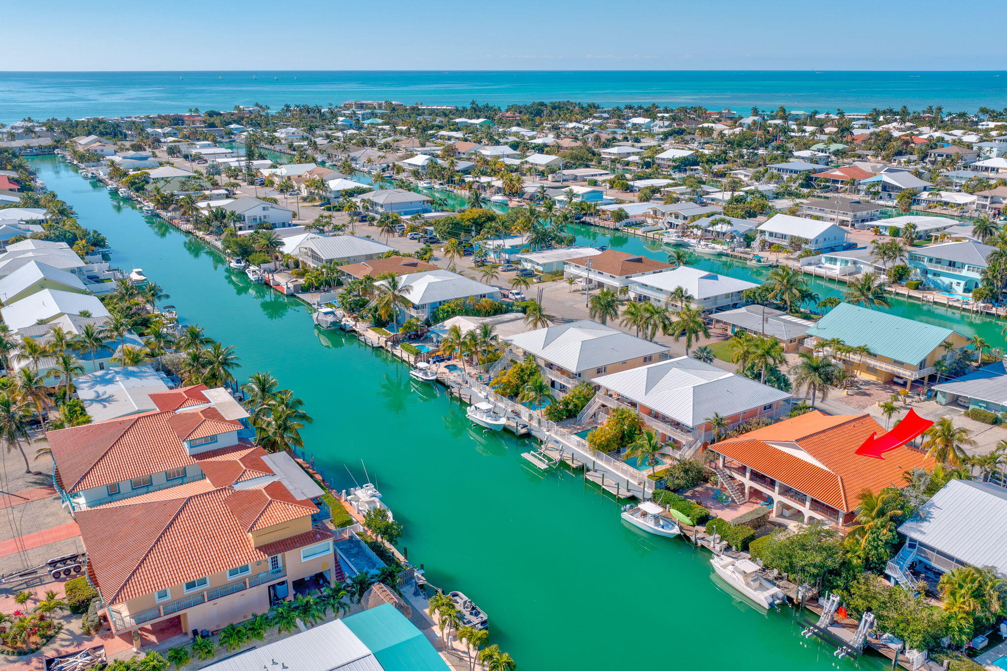 590 9th Street Key Colony Beach, FL 33051 - Photo 25 of 35 an aerial view of residential houses with outdoor space and swimming pool