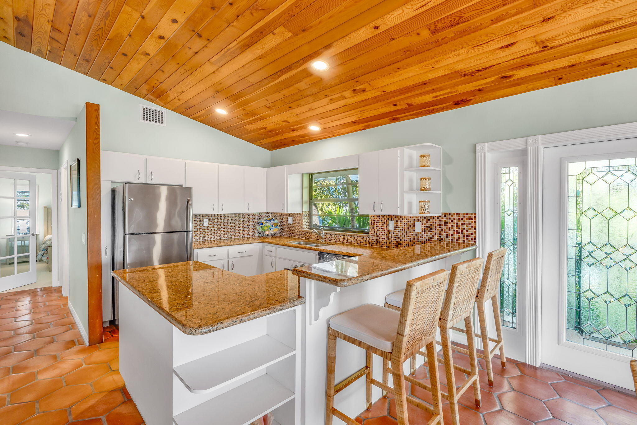 590 9th Street Key Colony Beach, FL 33051 - Photo 3 of 35 a kitchen with stainless steel appliances granite countertop a sink refrigerator and cabinets