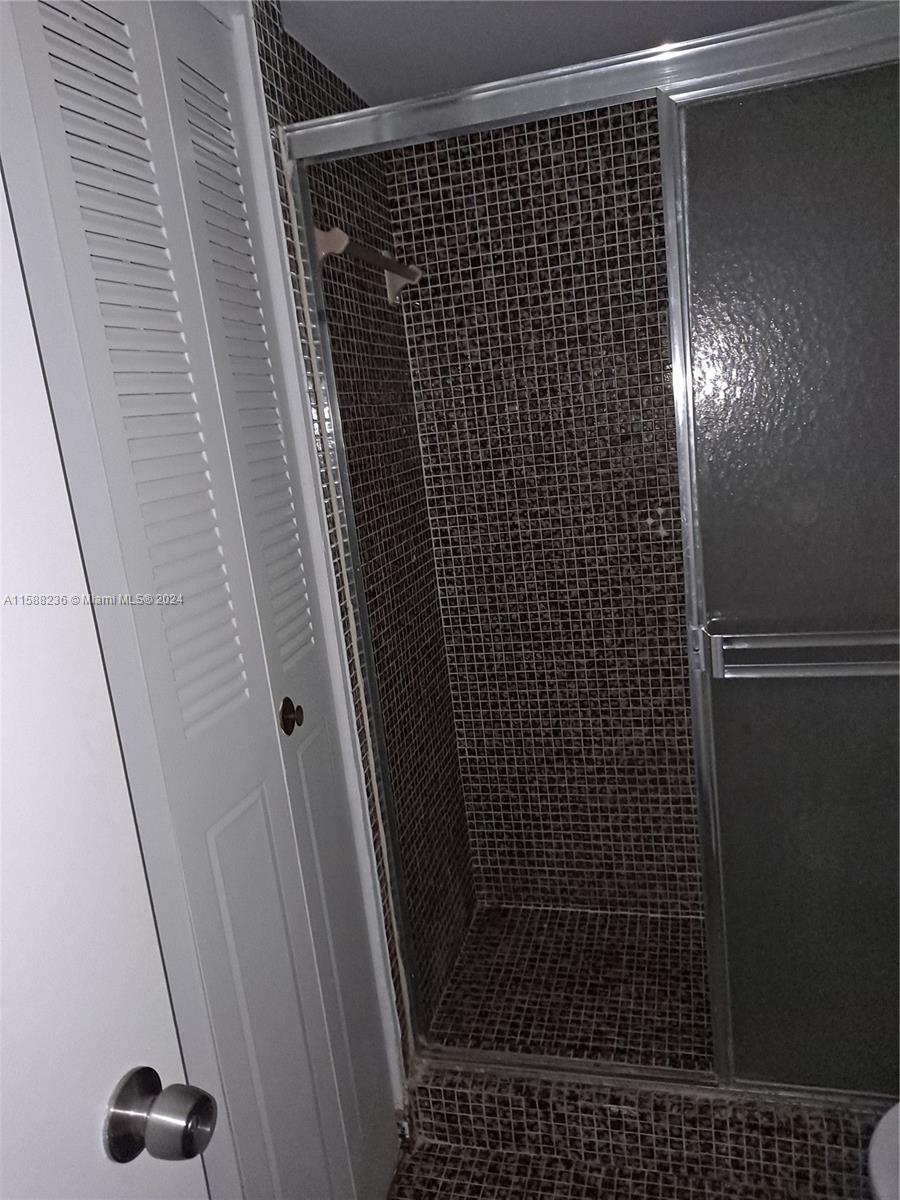 Buckley Towers Miami, FL 33179 - Photo 7 of 10 a bathroom with a shower