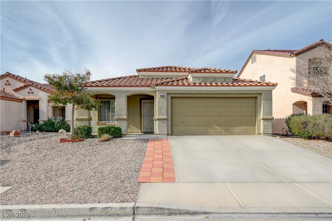 9929 Princess Cut Street Las Vegas, NV 89183 - Photo 2 of 52 Mediterranean / spanish house with driveway, stucco siding, an attached garage, and a tile roof