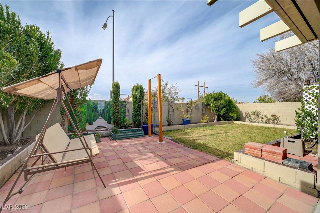 9929 Princess Cut Street Las Vegas, NV 89183 - Photo 44 of 52 Fenced backyard with a patio