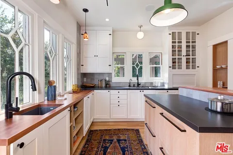 a bedroom with a large bed and a large window