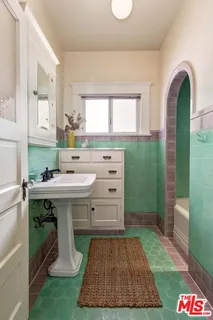 a utility room with sink dryer and washer