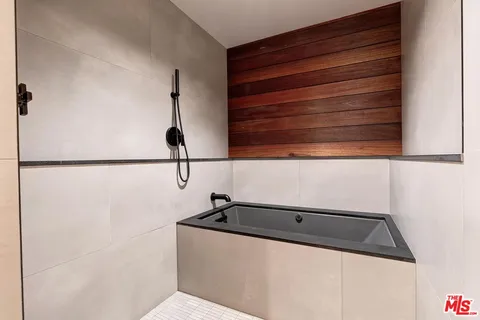 a living room with lots of furniture and a large window